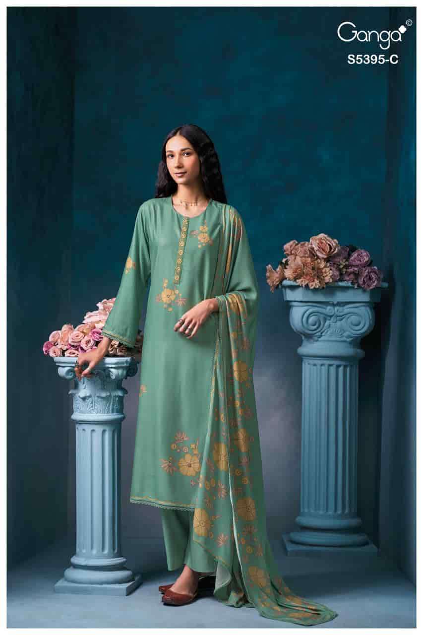 FYREVIA SERIES 5395 BY GANGA DESIGNER PRINTED WITH HAND WORK AND EMBROIDERY WORK WOOL PASHMINA SUITS ARE AVAILABLE AT WHOLESALE PRICE